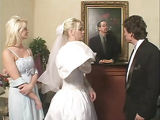 Blonde Bride fucks two enduring cocks in bed